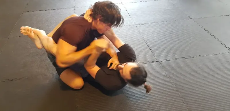 No-Gi Jiu Jitsu Grappling – Mornington BJJ for Adults Two men grappling during No-Gi Jiu Jitsu training at First Degree Jiu Jitsu Mornington